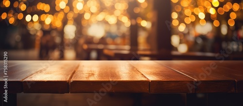 Wooden table with bokeh light effect at a cafe restaurant