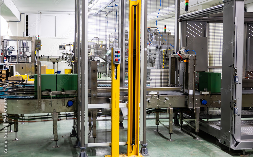 Automated bottling line machinery in modern winery. Automated bottling line machinery in modern winery.