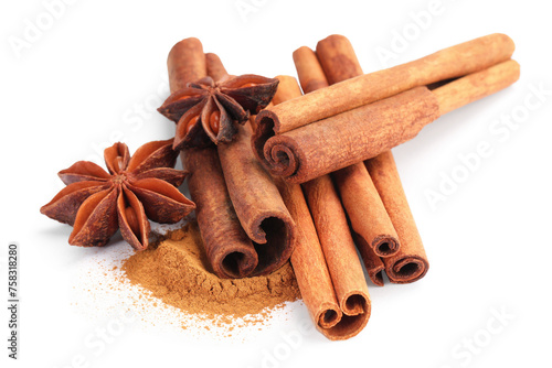 Dry aromatic cinnamon sticks, powder and anise stars isolated on white