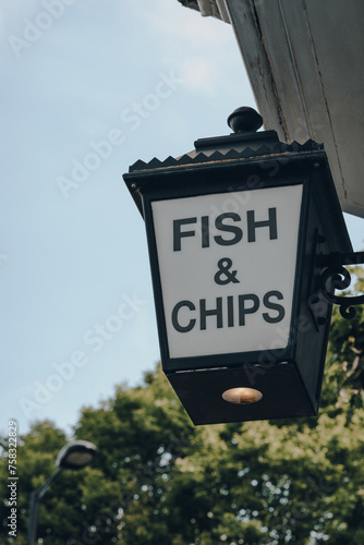 Fish and Chip sign outside a take away restaurant in London, UK. photo