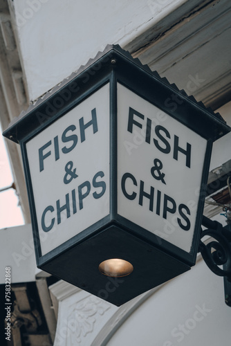 Fish and Chip sign outside a take away restaurant in London, UK. photo