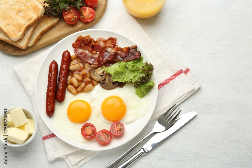 Delicious breakfast with sunny side up eggs served on white table, flat lay Delicious breakfast with sunny side up eggs served on white table, flat lay