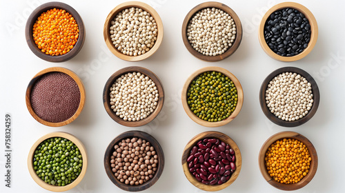 Top view of various beans, legumes and grains on a white background with copy space for healthy eating or grocery shopping concepts