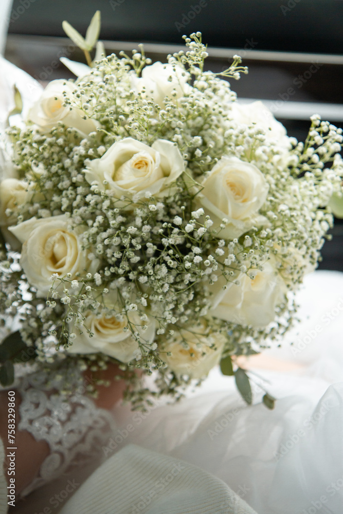 wedding bouquet in the hands of the bride and hands with rings of the newlyweds wedding bouquet in the hands of the bride and hands with rings of the newlyweds