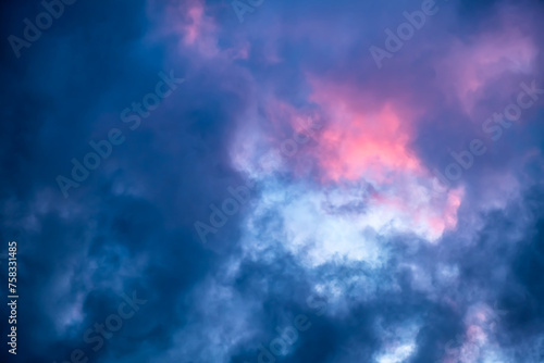 Blue hole in the dark cloudy sky. Storm Clouds. Evening sunset. Rainy and stormy weather. Art wallpaper. Natural landscape. Beauty in nature. After thunderstorm. The hope concept. High quality photo