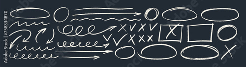 Collection various white chalk arrows, ovals, frames and check marks on blackboard.