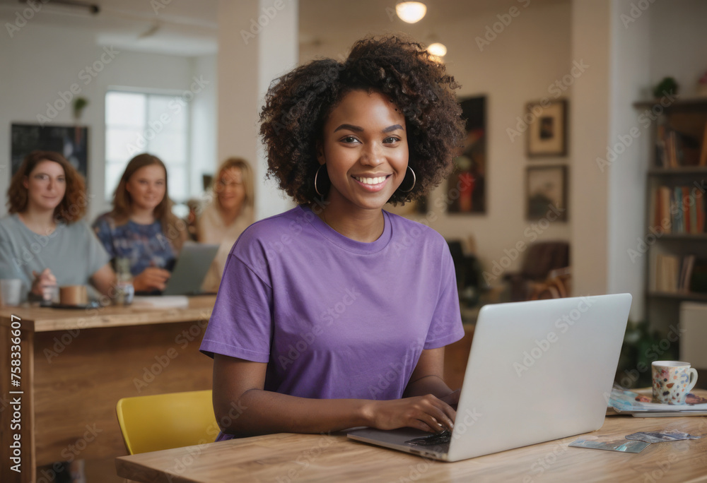 Happy woman in purple shirt using laptop at home.