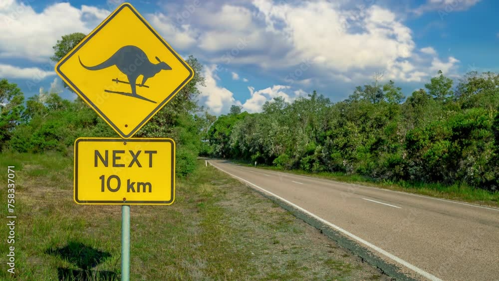 Fun and warning sign for kangaroo skiing on Austalian country road. Amusing and cautionary sign depicting a kangaroo skiing on an Australian country road. Cinemagraph. Fun and warning sign for kangaroo skiing on Austalian country road. Amusing and cautionary sign depicting a kangaroo skiing on an Australian country road. Cinemagraph.