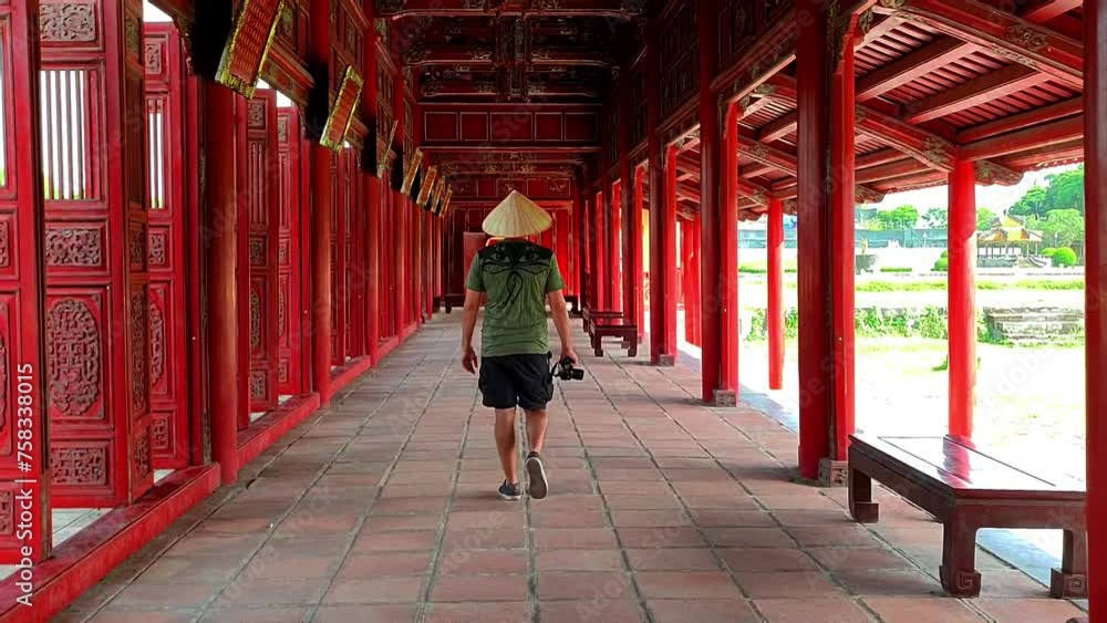 Young man touring the beautiful Imperial City of Hue, Vietnam. Man traveling alone in Vietnam. Young photographer enjoying the beautiful city of Hue, Vietnam. Young man touring the beautiful Imperial City of Hue, Vietnam. Man traveling alone in Vietnam. Young photographer enjoying the beautiful city of Hue, Vietnam.