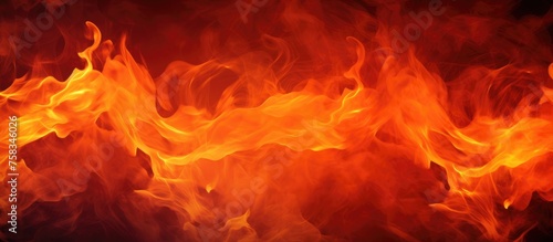 A closeup image captures the intense heat of a roaring fire, with billowing clouds of smoke mixing with the amberorange flames, creating a striking geological phenomenon