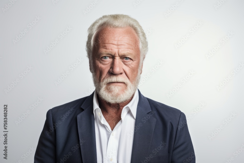 Portrait of a senior man with grey hair and beard. Studio shot. Portrait of a senior man with grey hair and beard. Studio shot.