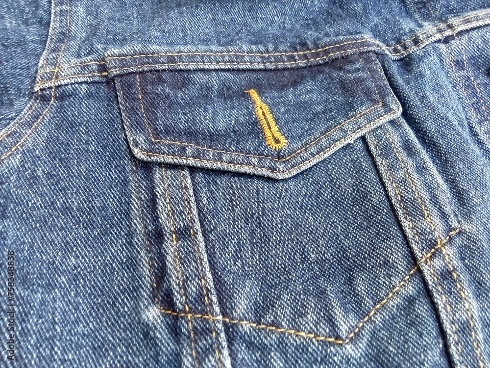 Close up pocket pocket on denim jeans jacket, fashion theme. Close up pocket pocket on denim jeans jacket, fashion theme.