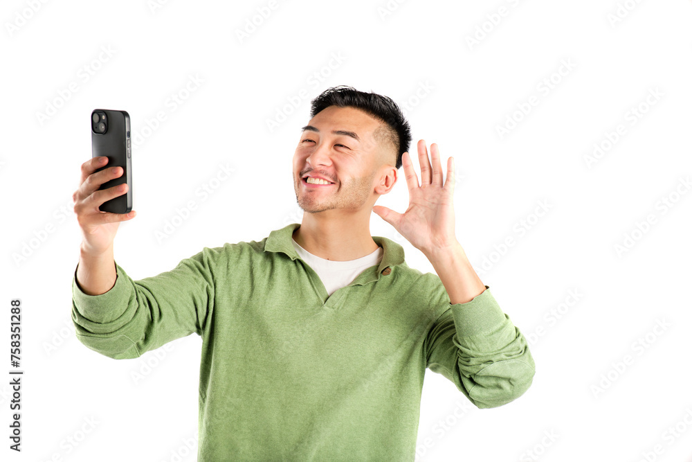 smiling young asian man in green shirt taking a selfie with his smart phone on white background smiling young asian man in green shirt taking a selfie with his smart phone on white background