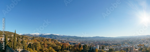 Panorama of beautiful autumn landscape of Sierra Nevada with snow capped mountains seen from the Alhambra, Granada, Andalusia, Spain