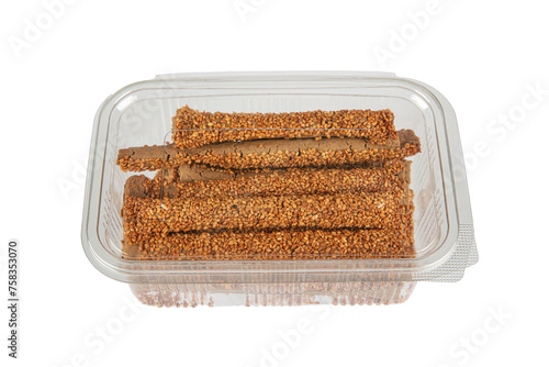 Sesame stick crackers, crispy bread straw. Pretzel bread sticks with sesame seeds, snacks. photo