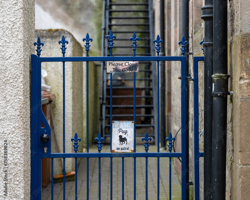 14 March 2024. Elgin,Moray,Scotland. This is a sign on a gate to a dwelling indicating that a Pug Dog is on Patrol. 14 March 2024. Elgin,Moray,Scotland. This is a sign on a gate to a dwelling indicating that a Pug Dog is on Patrol.