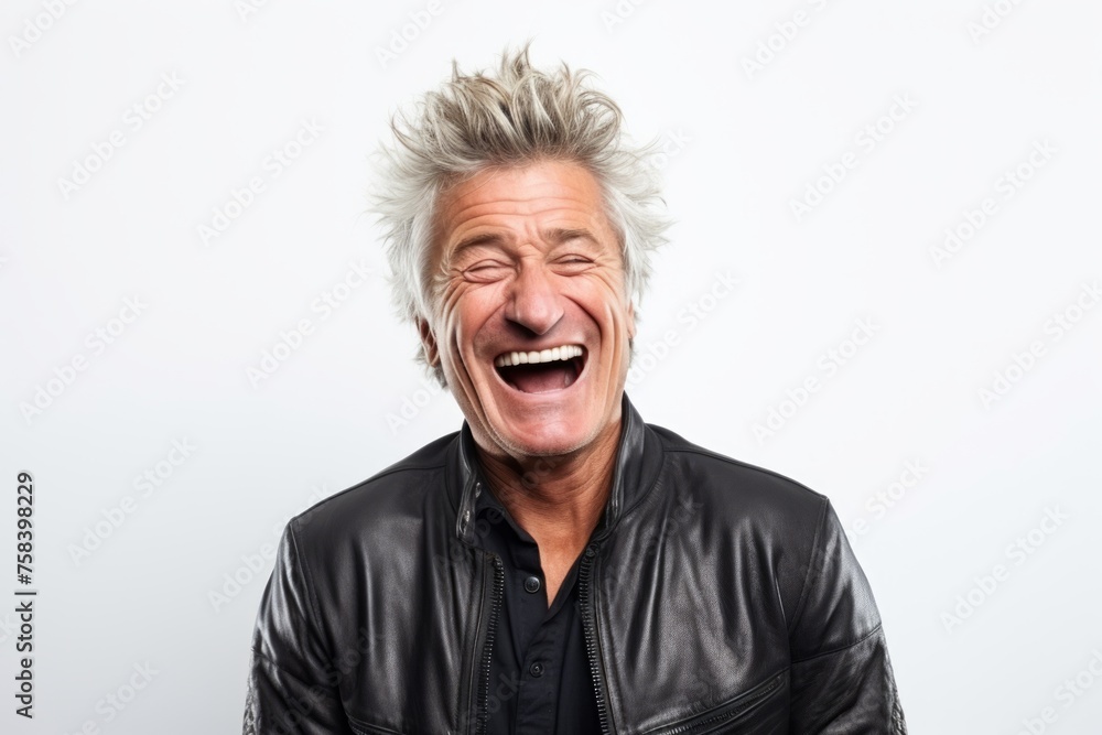 Portrait of a happy senior man laughing on a white background. Portrait of a happy senior man laughing on a white background.
