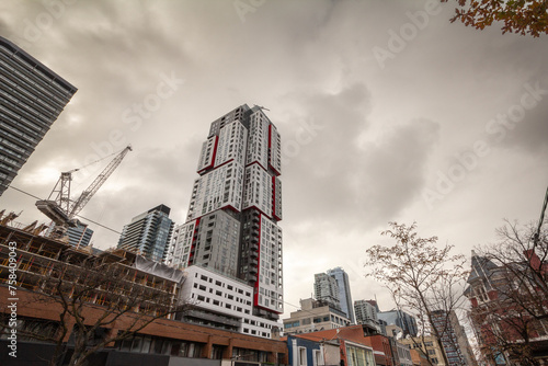 Photography Construction sites of rise condo apartment building towers on Queen Street, in an area of downtown Toronto being redeveloped, in the economic center of Canada, Toronto