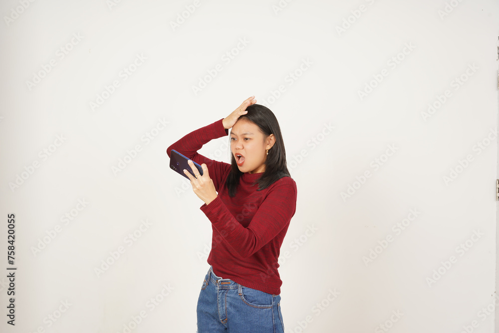 Young Asian woman in Red t-shirt Playing mobile game on smartphone isolated on white background Young Asian woman in Red t-shirt Playing mobile game on smartphone isolated on white background