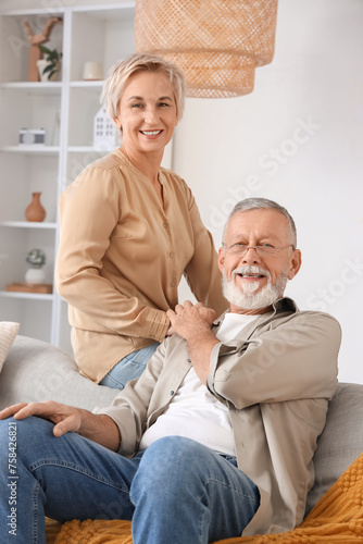 Mature couple holding hands...