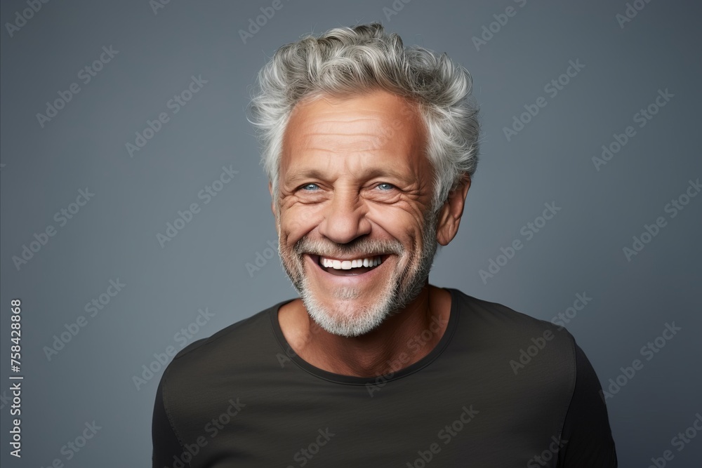 Portrait of a smiling senior man with grey hair and beard. Portrait of a smiling senior man with grey hair and beard.