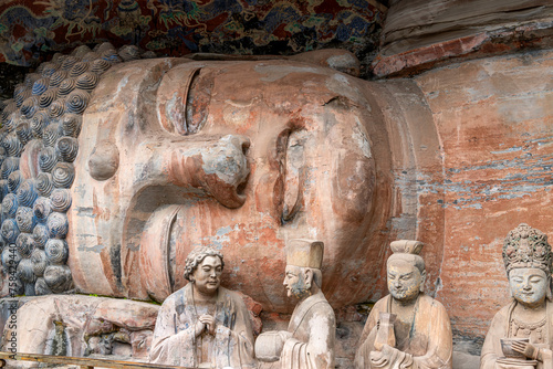 Rock sculpture of the 31m sleeping buddha statue of sakyamuni entering nirvana