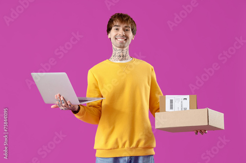 Smiling young man holding l...
