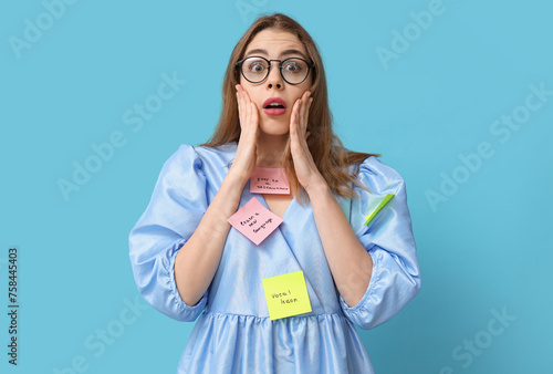 Excited young woman with st...