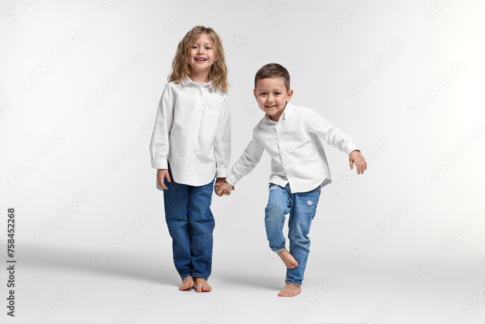 Cute little children on white background. Happy family Cute little children on white background. Happy family