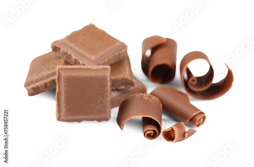 Delicious chocolate shavings and pieces isolated on white