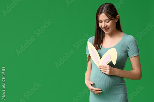 Pregnant woman holding bunn...