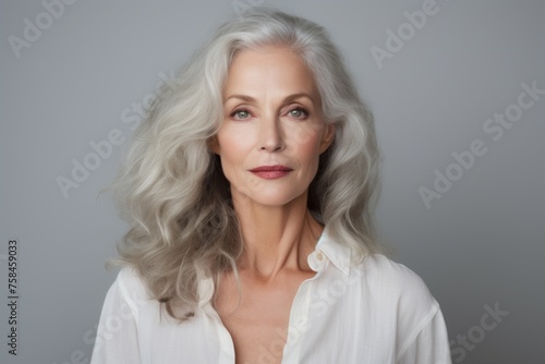 Portrait of a beautiful senior woman with grey hair, studio shot