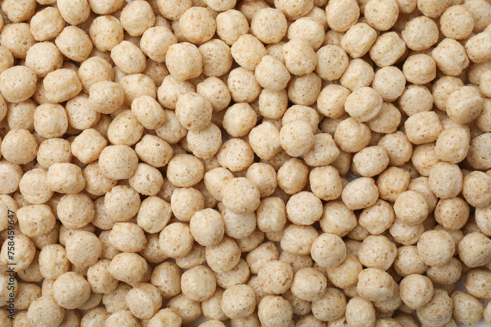 Tasty sweet cereal balls as background, top view