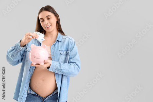 Pregnant woman saving money...