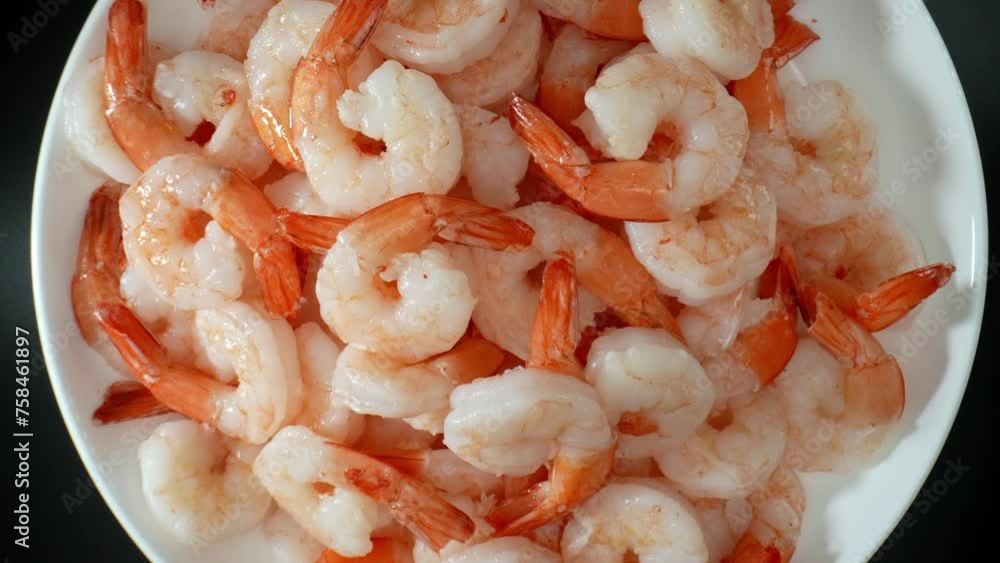Frozen shrimp: harvested from sea, processed, frozen for freshness. Popular seafood globally for mild flavor, cooking versatility, quick cooking time. Food concept. Seafood background. 4K HDR. Frozen shrimp: harvested from sea, processed, frozen for freshness. Popular seafood globally for mild flavor, cooking versatility, quick cooking time. Food concept. Seafood background. 4K HDR.