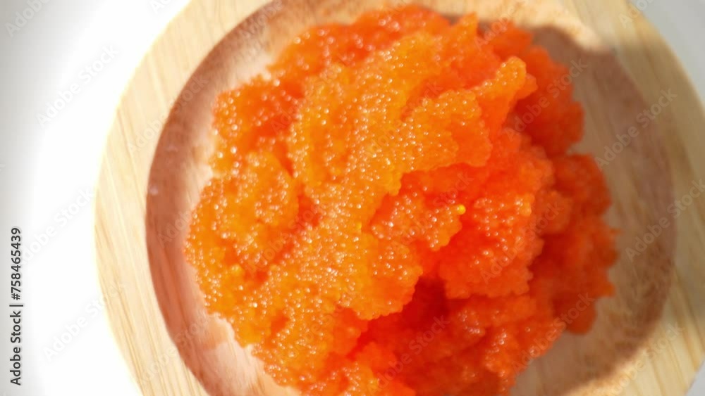 Tobiko has a distinctive briny taste, reminiscent of the ocean. It adds a subtle yet flavorful essence to any dish it accompanies. Seafood concept. Shot with 24mm probe macro lens. Tobiko background.
Tobiko has a distinctive briny taste, reminiscent of the ocean. It adds a subtle yet flavorful essence to any dish it accompanies. Seafood concept. Shot with 24mm probe macro lens. Tobiko background.
