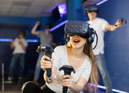 girl in virtual reality helmet dodges fiery rain overcoming obstacles in vr game. Metaverse console, entertainment club