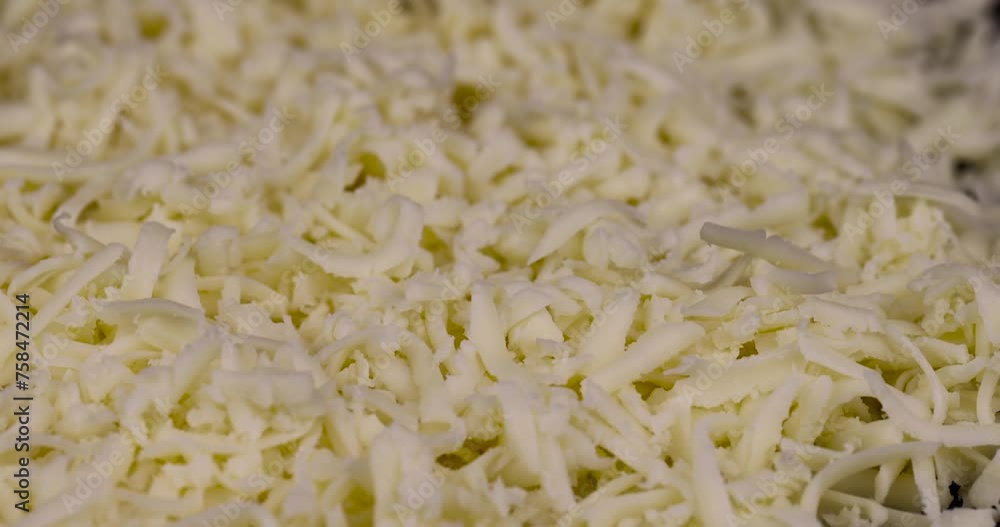 grated cheese in large quantities at home, grated cheese for cooking in the kitchen grated cheese in large quantities at home, grated cheese for cooking in the kitchen