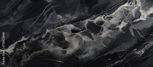A closeup of a black and white marble texture resembles a cloudy sky or a geological phenomenon. The pattern creates a sense of depth and space, like a landscape or a cumulus cloud photo