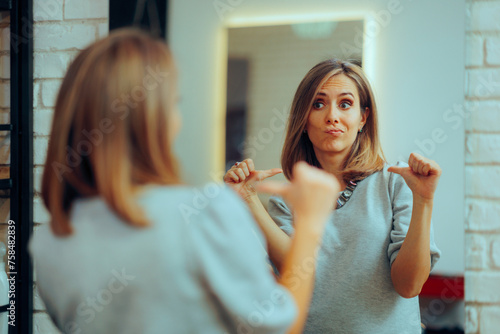 Woman Looking in the Mirror Pointing to herself at the Salon. Self-obsessed vain girl checking herself in a mirror
