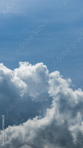 Timelapse of a sky with passing cloudsin vertical photo