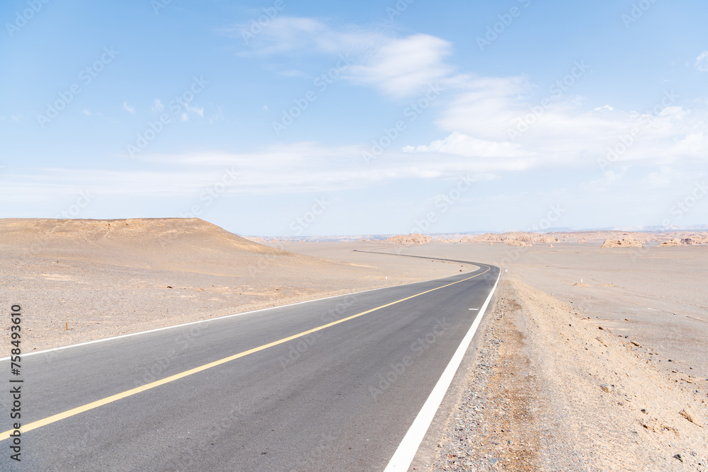 Tourist road in the Devil City in Hami, Xinjiang, China Tourist road in the Devil City in Hami, Xinjiang, China