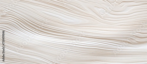 A close up of a white marble texture with a swirl pattern, resembling hardwood flooring. The mix of beige and grey tones give it a unique look