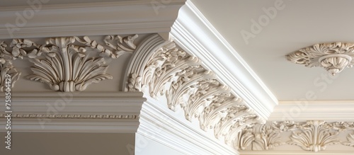 Intricate crown molding on a corner ceiling. photo