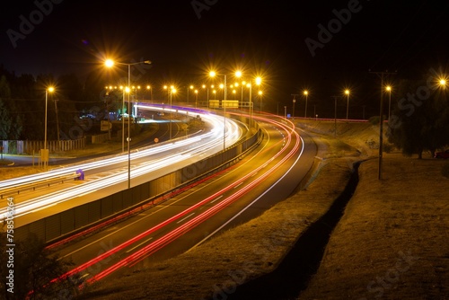 curved road with vehicle lights, long exposure, chile
