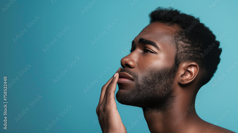 Pensive afro american man with sad face, hand on lip, on soothing blue background. Herpes concept. Banner, copy space. Pensive afro american man with sad face, hand on lip, on soothing blue background. Herpes concept. Banner, copy space.