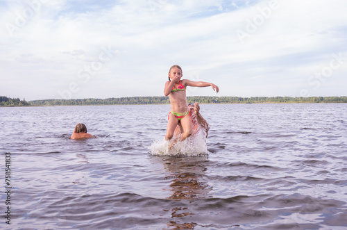 People frolic in the water on a hot, sunny summer day. 