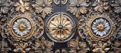 A detailed gold and silver floral pattern adorns the wall, showcasing intricate artistry and symmetry in the buildings facade