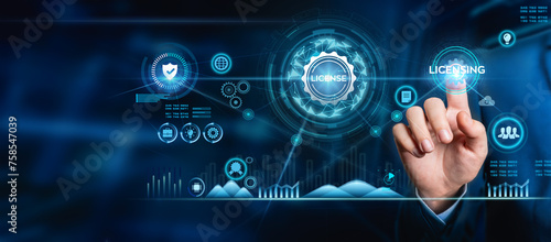 Businessman hand touching LICENSING sign on virtual screen.