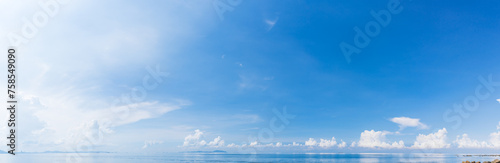 Panorama blue sky with white fluffy clouds